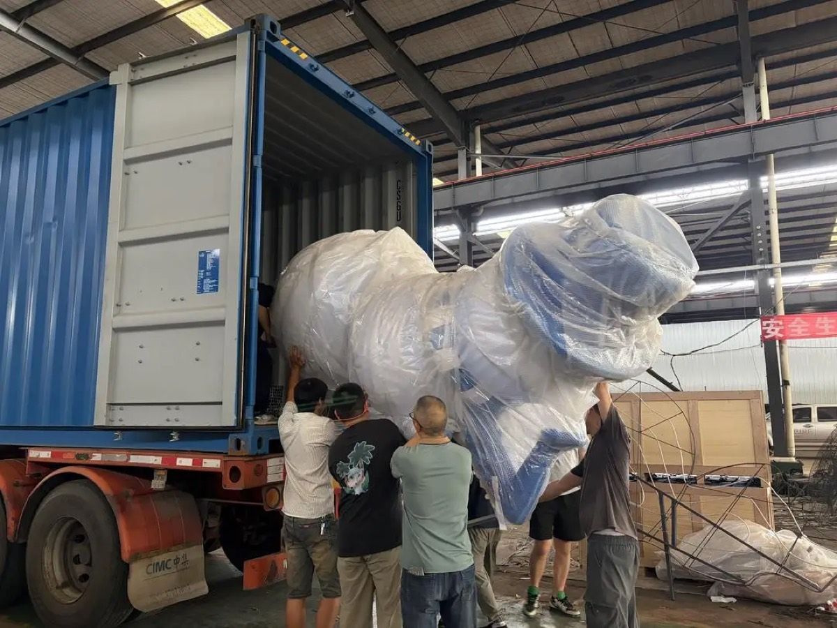 Giant lantern sculpture loaded into export container
