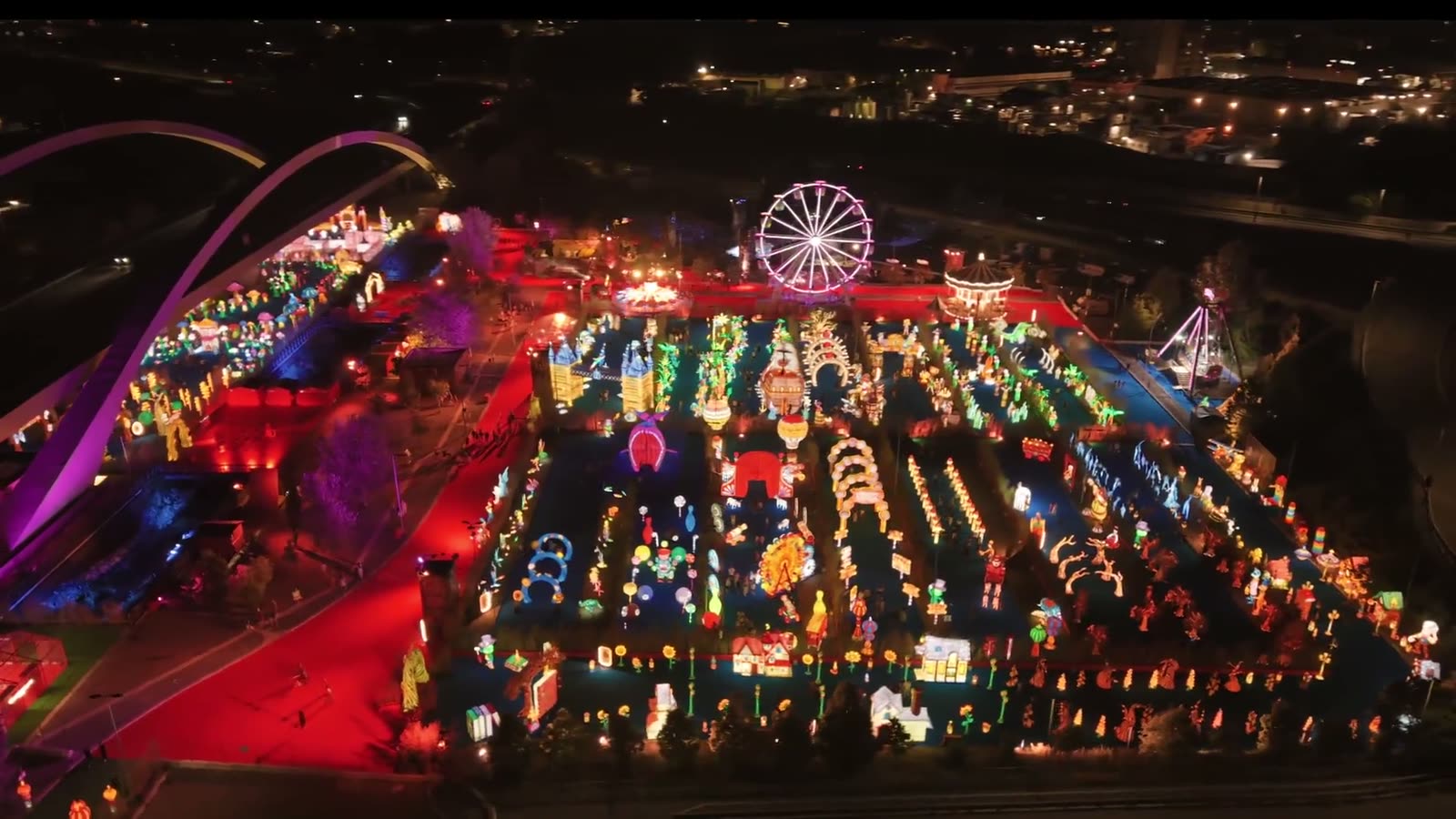 Aerial view of a large-scale lantern festival at night with light installations and pathways