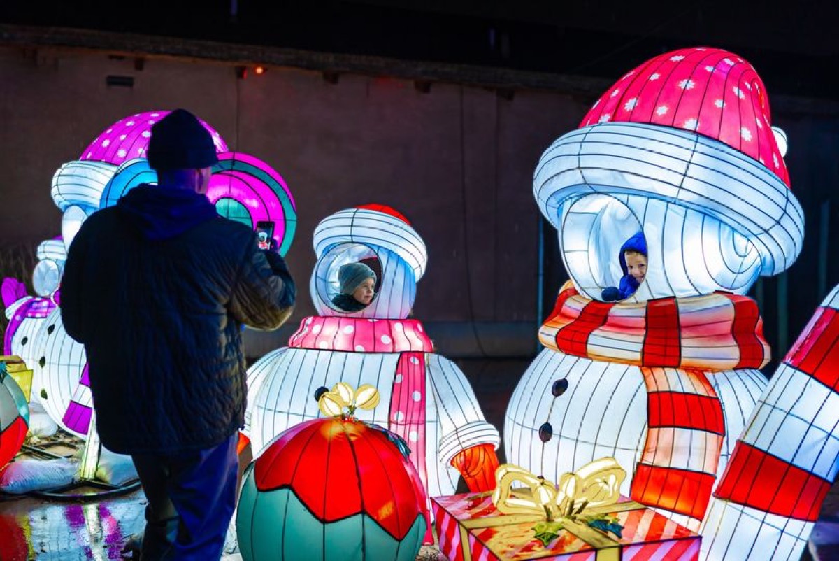Giant snowman lanterns at a European winter light festival