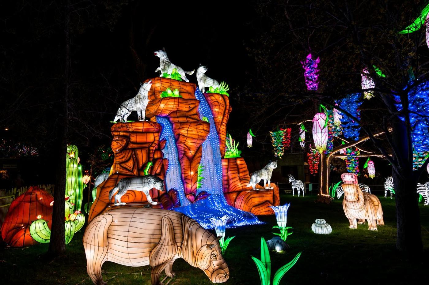 African savannah animal kingdom lantern display with waterfall at night